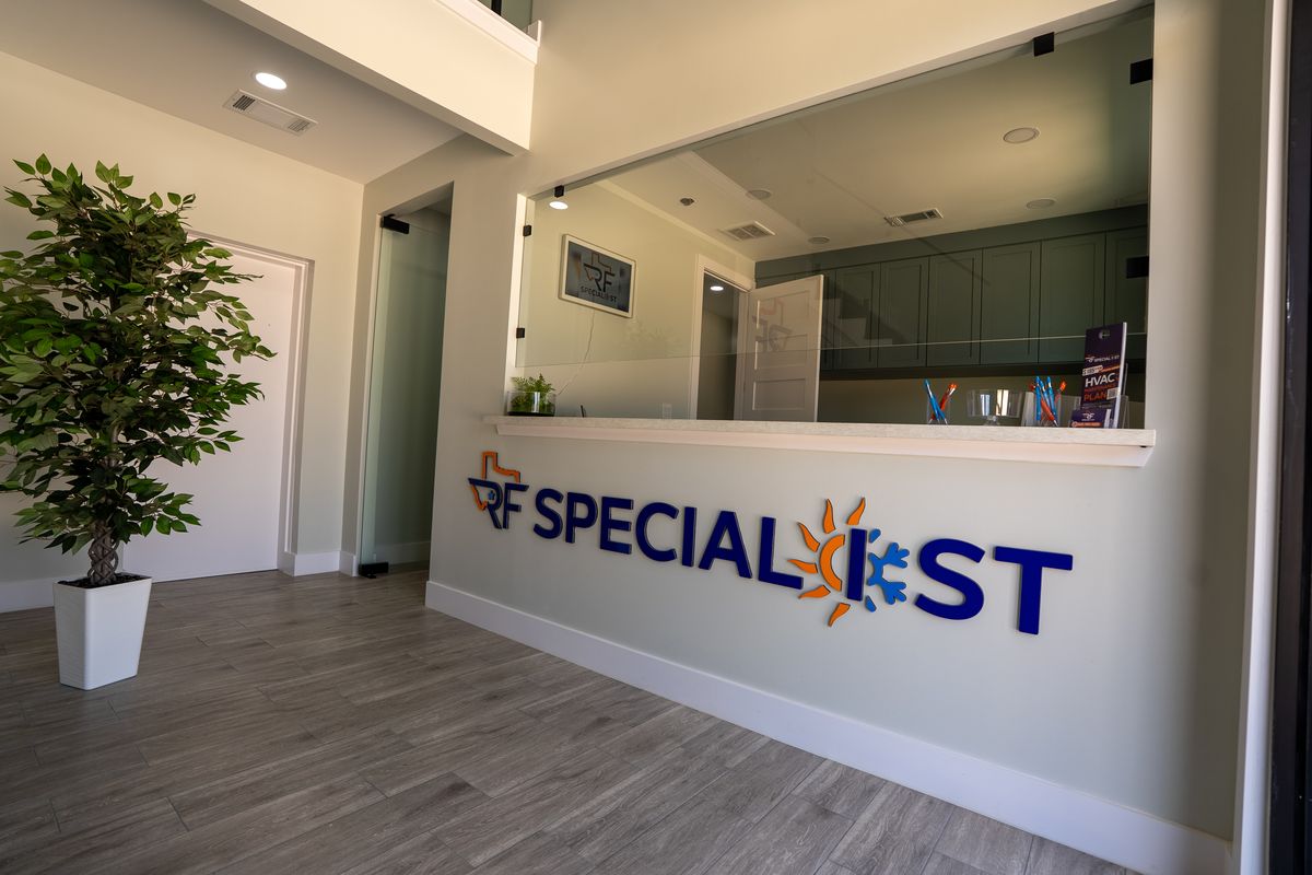 The reception counter at the RF Specialist office with the company logo.